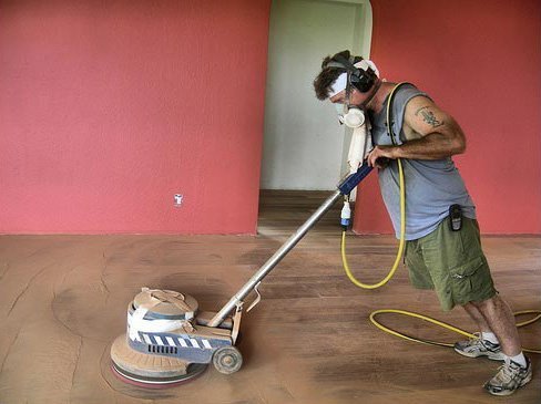 Refinishing hardwood floors.